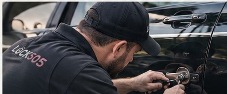 Locksmith technician working on a vehicle lock
